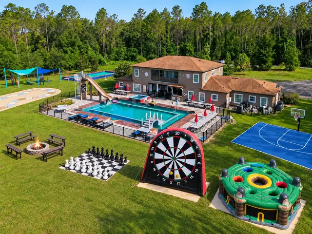 Parkside backyard with the pool, waterslide and outdoor games