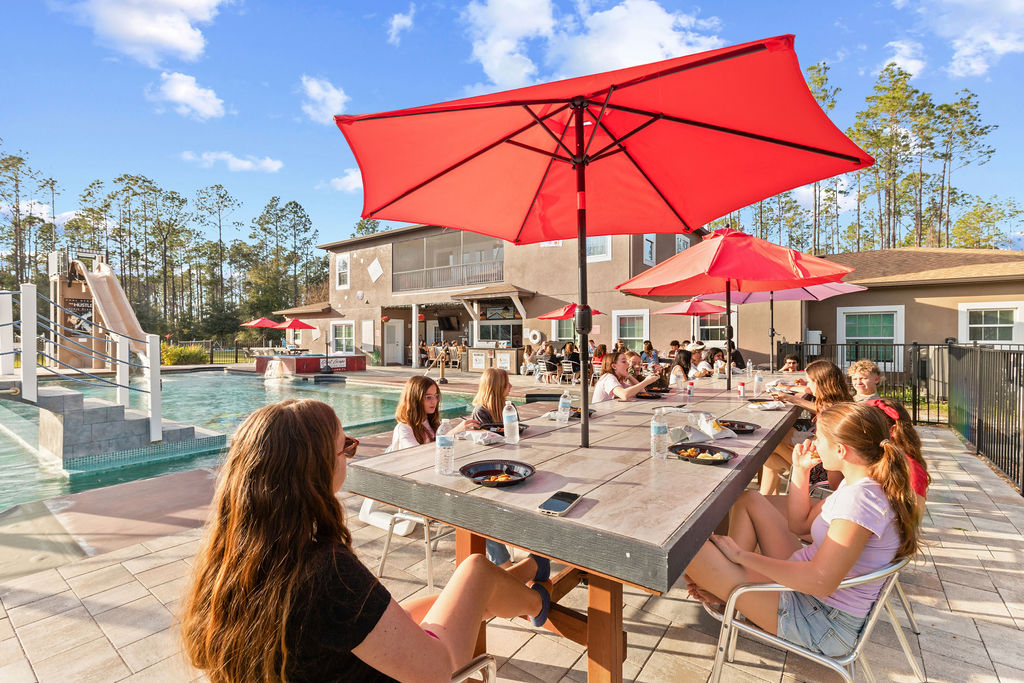 Poolside dinning under the umbrellas.