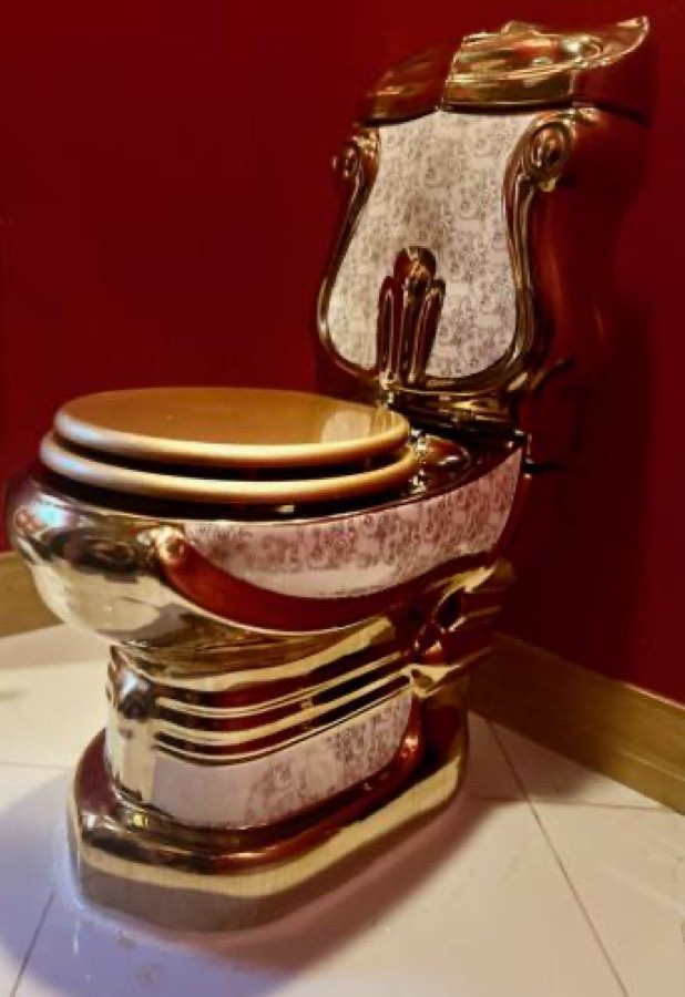Solid gold toilet in the Vegas Casino Games Suite at The Great Escape Lakeside, Clermont FL