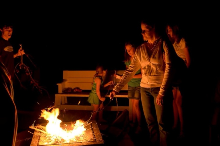 Glow-lit campfire celebration.