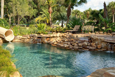 The lagoon pool at The Ever After Estate private island vacation home rental near Disney World and Orlando